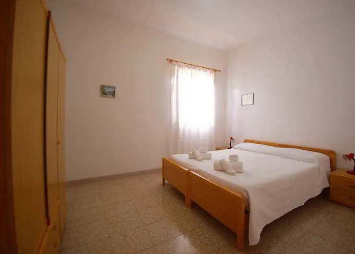 Lägenhetshotell Villaggio Pineta Petto Bianco